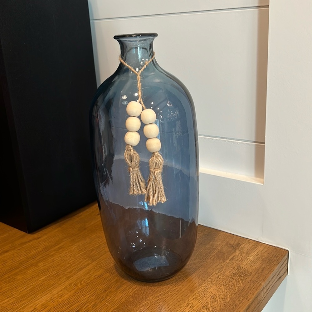 Blue decorative vase with tassels